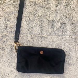 Lululemon black and gold clutch